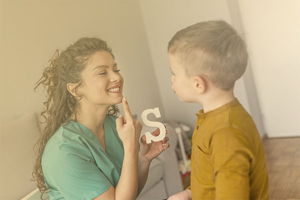 speech therapist working with young child