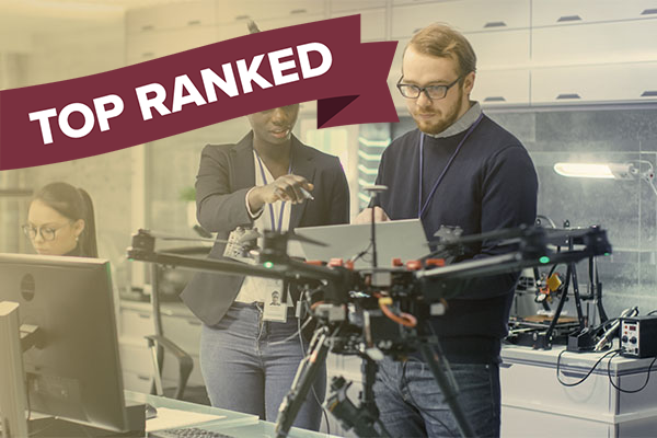 pair of engineers working with "top ranked" banner over image