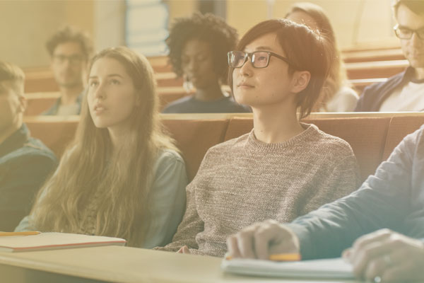 students at desks in lecture hall
