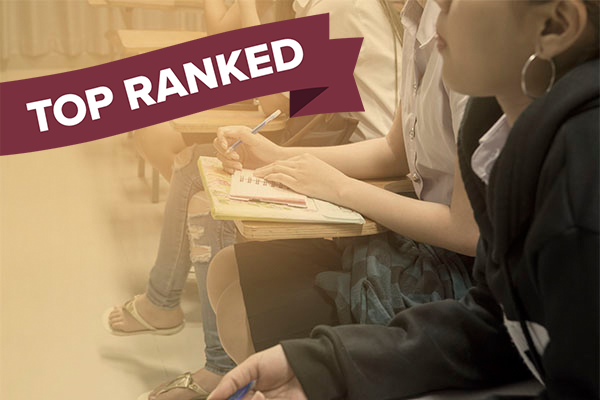 students in classroom listening to instructor and "top ranked" banner