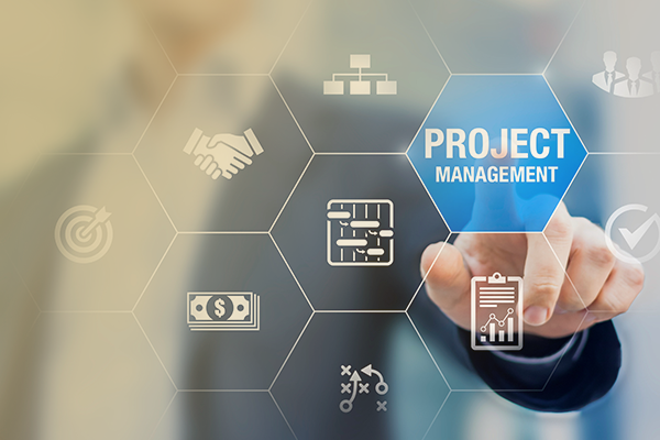 man at lightboard with text spelling out "project management"