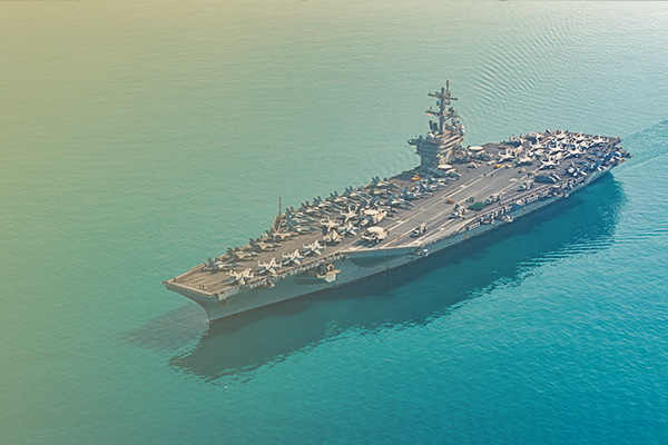Photo of a military aircraft carrier in the ocean