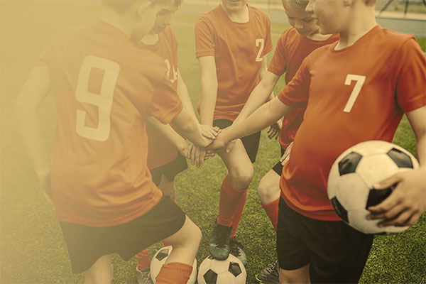 soccer players in a huddle