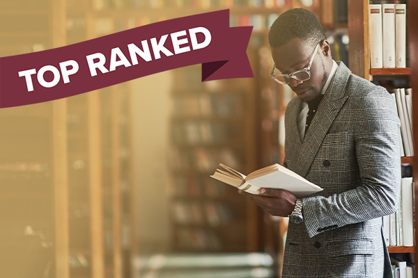 educator with book in library and "top ranked" banner